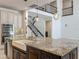 Gourmet kitchen featuring a large center island, farmhouse sink, and stainless steel appliances at 8530 Vivaro Isle Way, Windermere, FL 34786