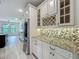 Gourmet kitchen features stainless steel appliances and stylish countertops at 8530 Vivaro Isle Way, Windermere, FL 34786