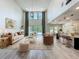 Open-concept living room features tall ceilings and seamless flow to kitchen at 8530 Vivaro Isle Way, Windermere, FL 34786