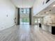 Spacious living room with high ceilings, natural light, and backyard pool view at 8530 Vivaro Isle Way, Windermere, FL 34786