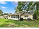 Backyard featuring a grill, patio, and lawn at 8709 Sw 96Th St # A, Ocala, FL 34481