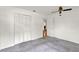 A carpeted bedroom features a large closet and natural lighting at 8709 Sw 96Th St # A, Ocala, FL 34481