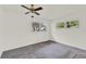 A bright bedroom with carpet, natural lighting, and ample space to relax at 8709 Sw 96Th St # A, Ocala, FL 34481