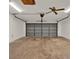 Spacious garage with ceiling fan, florescent lighting and new garage door at 8709 Sw 96Th St # A, Ocala, FL 34481