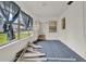 Bright lanai featuring striped floor, and access to the back yard at 8709 Sw 96Th St # A, Ocala, FL 34481