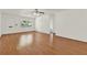 Bright living room with wood floors and a ceiling fan at 8709 Sw 96Th St # A, Ocala, FL 34481