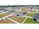 Aerial view showcases this home's neighborhood setting, with fenced backyard, solar panels, and a boat at 8978 Se 42Nd Ct, Ocala, FL 34480
