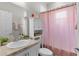 Clean bathroom featuring a shower with a curtain and a vanity at 8978 Se 42Nd Ct, Ocala, FL 34480