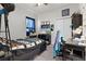 Welcoming bedroom with carpeted floor and featuring a desk, TV and ceiling fan at 8978 Se 42Nd Ct, Ocala, FL 34480