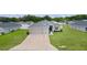 Charming single-story home featuring a three-car garage and well-maintained lawn at 8978 Se 42Nd Ct, Ocala, FL 34480
