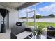 The screened lanai features outdoor seating, a view of the fenced backyard, and privacy at 8978 Se 42Nd Ct, Ocala, FL 34480