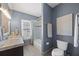 Charming bathroom with granite countertops, a tub with shower, and modern fixtures at 9648 Weatherstone, Windermere, FL 34786