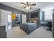 Cozy bedroom with gray walls, ceiling fan, carpet, and a window offering natural light and a desk at 9648 Weatherstone, Windermere, FL 34786
