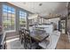 Open dining area featuring a modern chandelier and oversized windows, perfect for entertaining at 9648 Weatherstone, Windermere, FL 34786