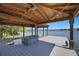 Spacious covered dock featuring seating, storage, and lake access for boating and leisure at 9648 Weatherstone, Windermere, FL 34786