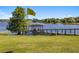 Lakeside dock with covered seating area, perfect for enjoying waterfront views and activities at 9648 Weatherstone, Windermere, FL 34786