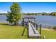 Picturesque dock with covered seating, offering tranquil lake access and scenic surroundings at 9648 Weatherstone, Windermere, FL 34786