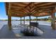 Well-equipped boat dock with lift, storage, and overhead cover, ideal for boating enthusiasts at 9648 Weatherstone, Windermere, FL 34786
