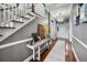 Spacious foyer with hardwood floors, decorative console table, and a chandelier-lit entrance at 9648 Weatherstone, Windermere, FL 34786