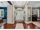 Bright foyer featuring hardwood floors and views into adjacent rooms at 9648 Weatherstone, Windermere, FL 34786