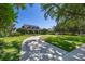 Inviting home featuring a long driveway, manicured lawn, and a charming front porch at 9648 Weatherstone, Windermere, FL 34786