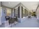 Spacious porch with comfortable seating and a relaxing view at 9648 Weatherstone, Windermere, FL 34786