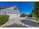 Spacious three-car garage with a wide driveway offering ample parking and lake views at 9648 Weatherstone, Windermere, FL 34786