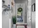 Hallway with a view to the exterior, light grey paint, and updated decorations at 9648 Weatherstone, Windermere, FL 34786