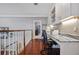 Hallway featuring a built-in desk area with granite countertops and access to other rooms at 9648 Weatherstone, Windermere, FL 34786