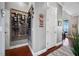 Hallway with a wine rack against one wall, and a view of the dining area to the exterior at 9648 Weatherstone, Windermere, FL 34786