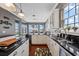 Well-lit kitchen features modern appliances, a kitchen island, and plenty of natural light at 9648 Weatherstone, Windermere, FL 34786
