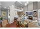 Expansive living room with a fireplace, built-in shelving, and staircase at 9648 Weatherstone, Windermere, FL 34786