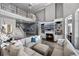 Spacious living room with a fireplace, built-in shelving, and a lofted balcony at 9648 Weatherstone, Windermere, FL 34786