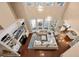 Overhead view of the living room with a fireplace, built-in shelving, and large windows at 9648 Weatherstone, Windermere, FL 34786