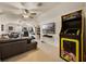 Spacious living room featuring a drum set, multi-arcade game and ceiling fan at 9648 Weatherstone, Windermere, FL 34786
