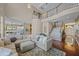 Open-concept living room with staircase and second story, plush sectional sofa, and access to the kitchen and foyer at 9648 Weatherstone, Windermere, FL 34786