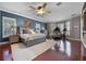 Spacious main bedroom with a ceiling fan, seating area, and generous natural light at 9648 Weatherstone, Windermere, FL 34786
