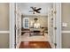 Office featuring hardwood floors, a ceiling fan, large desk and french doors at 9648 Weatherstone, Windermere, FL 34786