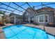 Backyard pool with a screened enclosure and plenty of patio space for outdoor entertaining at 9648 Weatherstone, Windermere, FL 34786