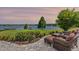 Beautiful patio with comfortable seating overlooking a serene lake view, perfect for relaxing and entertaining at 9648 Weatherstone, Windermere, FL 34786