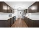 Modern kitchen features white subway tile backsplash, stainless steel appliances, and ample counter space at 9782 County Road 121, Wildwood, FL 34785