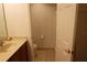 Standard bathroom with tiled floor, neutral-toned countertop, and white toilet at 10115 Regent Park Dr # 2503, Orlando, FL 32825