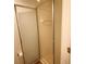 Neutral bathroom with white tiled walls and a frosted glass enclosed shower at 10115 Regent Park Dr # 2503, Orlando, FL 32825