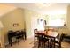 Inviting dining area featuring a wooden table set, a breakfast bar, and views of the kitchen area at 10115 Regent Park Dr # 2503, Orlando, FL 32825