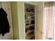 Pantry with wire shelving providing ample storage space and organization, lit by nearby window at 10115 Regent Park Dr # 2503, Orlando, FL 32825