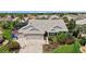 Beautiful home with three-car garage, paver driveway, and manicured landscaping at 1053 Alcove Loop, The Villages, FL 32162