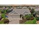 Charming home with a 3-car garage, meticulously landscaped yard, and brick-paved driveway in a lush community at 1053 Alcove Loop, The Villages, FL 32162