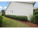 Well-maintained property with lush greenery and a neatly manicured lawn at 1053 Alcove Loop, The Villages, FL 32162