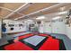 Spacious garage featuring epoxy flooring, ample storage, and well-lit work area at 1053 Alcove Loop, The Villages, FL 32162