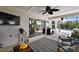 Enclosed patio space with comfortable seating, mounted tv, and outdoor views, great for relaxation at 1053 Alcove Loop, The Villages, FL 32162